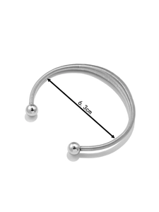 Detailed top view of a silver spring stainless steel bangle with a 6.3cm inner diameter