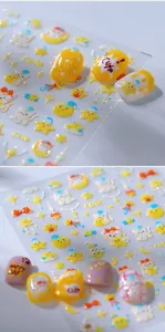 Macro view of 3D embossed cartoon cat nail art stickers with cute yellow star patterns