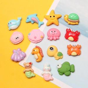 Colorful ocean themed resin charms featuring whales, starfish and crabs for DIY crafts