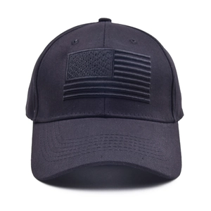 Black cotton baseball cap featuring embroidered American flag patch in tactical monochrome style