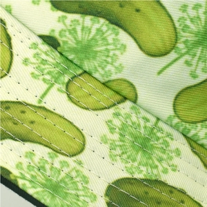 Macro shot of pickle pattern bucket hat with precise white parallel stitching details