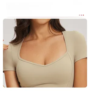 Detail of the diamond-shaped neckline on a high-stretch yoga top with lockbone accent