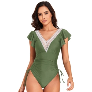 Detail view of olive green swimsuit featuring white lace V-neckline and ruffled cap sleeves