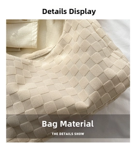 Close-up of beige woven fabric texture showing a 3D padded checkered pattern on the bag