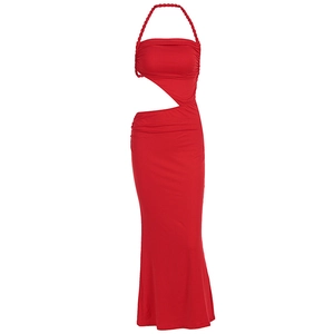 Detail of red halter neck dress with twist straps and asymmetric waist cut-out