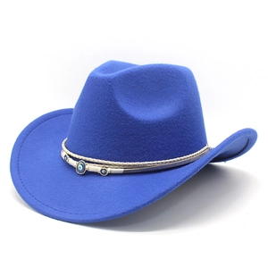 Close-up of royal blue wool wide-brim cowboy hat with woven evil eye charm band