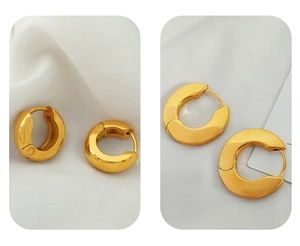 Close-up of two different styles of 18k gold plated geometric thick hoop earrings