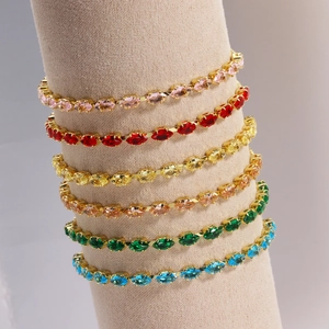 Detail of colorful marquise-cut zircon tennis bracelet with gold-plated claw setting