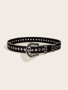 Detail of black western belt with silver star studs and engraved vintage buckle