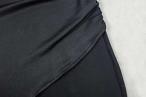 Close-up of black bodycon dress fabric texture and professional stitching details