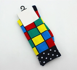 Detail of cotton crew socks with colorful geometric blocks and polka dot pattern