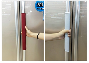 Detail of burgundy and grey fabric covers for refrigerator door handles in a kitchen