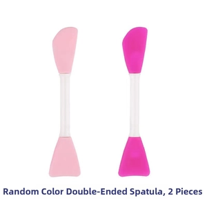 Close-up of double-headed silicone face mask brushes in pink and rose red for skincare