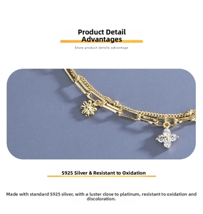 Macro shot of S925 sterling silver clover bracelet with double-layer chain and diamonds