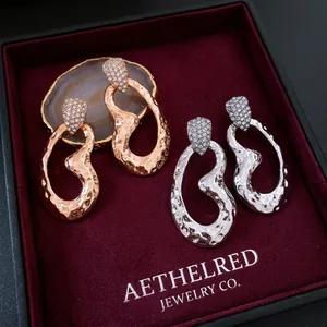Luxury oval drop earrings with silver needle and pavé zircons in silver and rose gold