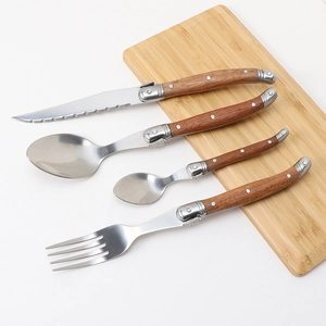 Detailed view of four-piece stainless steel cutlery set with Sapele wood rivet handles