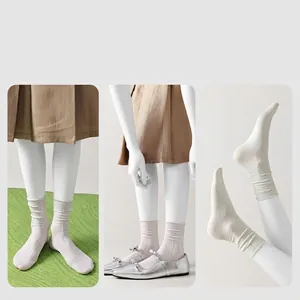 Breathable white ribbed silk socks for women styled with silver Mary Jane shoes