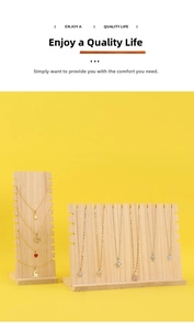 Detail of wooden necklace display stands with multi-slot design and various pendants