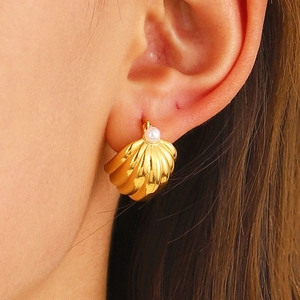 French style gold shell hoop earrings with white pearls shown on female model