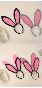 Detail view of plush bunny ear headbands in black, grey, white and brown for Easter parties
