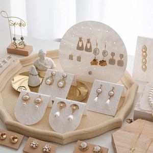 Elegant acrylic jewelry display stand with marble pattern for earrings and jewelry