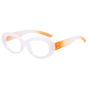 Oval gradient glasses with white to orange frame and metal star rivets on the sides