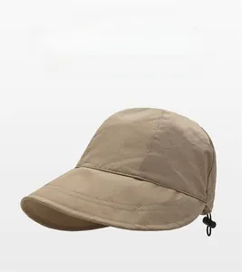 Detail of khaki outdoor sun hat featuring wide brim and adjustable black drawstring cord