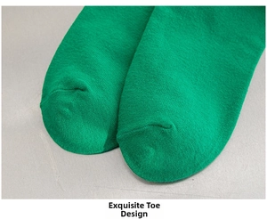 Close-up of fine knitting and flat seam construction on the toe of green cotton socks