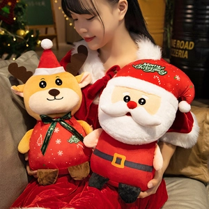Young woman holding cute plush Reindeer and Santa Claus dolls with Merry Christmas text