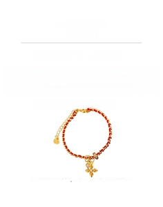 Detail view of woven red gold bracelet with zircon cross pendant and adjustable chain