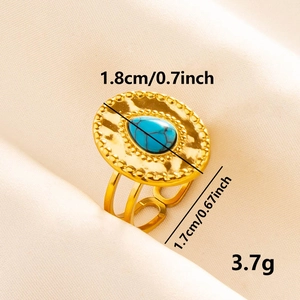 Golden 304 stainless steel open ring with blue turquoise gemstone on beige fabric