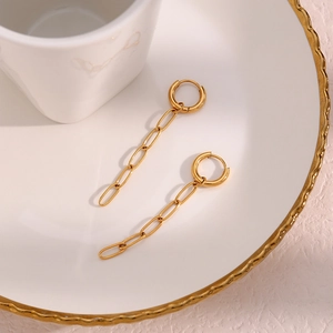 Minimalist long 18K gold plated stainless steel paperclip chain earrings on a white plate