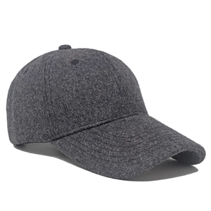 Detailed close-up of dark grey wool blend baseball cap with warm fleecy texture