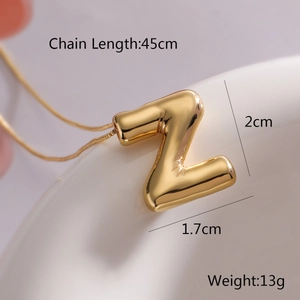 Detail shot of golden Z-pendant necklace with dimensions 45cm chain and 2cm height
