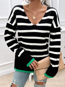 Detail of V-neck striped knit sweater with green contrast ribbed cuffs and hem