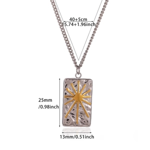 Detailed view of silver rectangular pendant with hammered texture and golden sunburst motif