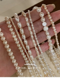 Close-up of assorted natural freshwater pearl necklaces in various sizes and shapes