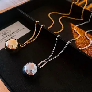 Polished titanium steel ball pendant necklace set in gold and silver finish