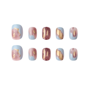 Abstract blue and pink marble press-on nails with gold foil accents on white background