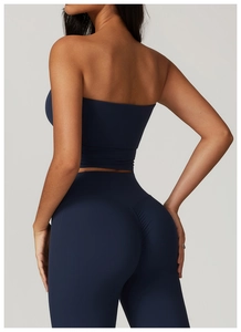 Vue arrière du haut de sport bustier bleu foncé et du legging de yoga taille haute