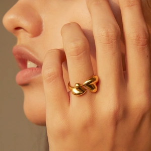 18K gold plated asymmetric heart open ring on model finger showing metallic luster