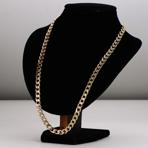 Modern 7mm Cuban link necklace in dual-tone gold and silver finish on a display