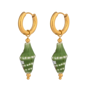 Detail shot of green ceramic conch earrings with golden rings and white speckles