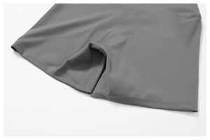 Detailed view of dark grey high-waist yoga shorts showing flatlock seam stitching details