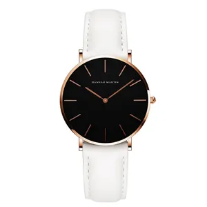 Minimalist women's quartz watch with black dial, rose gold case, and white leather strap