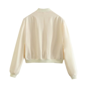 Back view of light beige stand collar jacket featuring ribbed cuffs and smooth texture