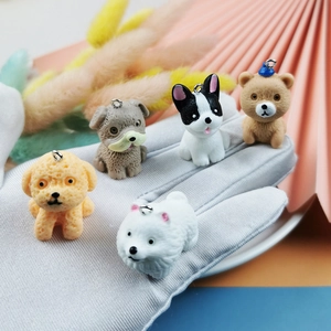 DIY colorful resin puppy charms for jewelry making with metal rings shown in hand