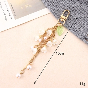 Charming lily of the valley keychain with white flower bells and gold lobster clasp