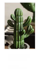 Detailed view of dark green resin cactus decor with realistic textures in a grey pot