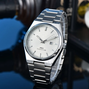 Detail shot of the white textured dial and silver steel strap on the PRX quartz watch